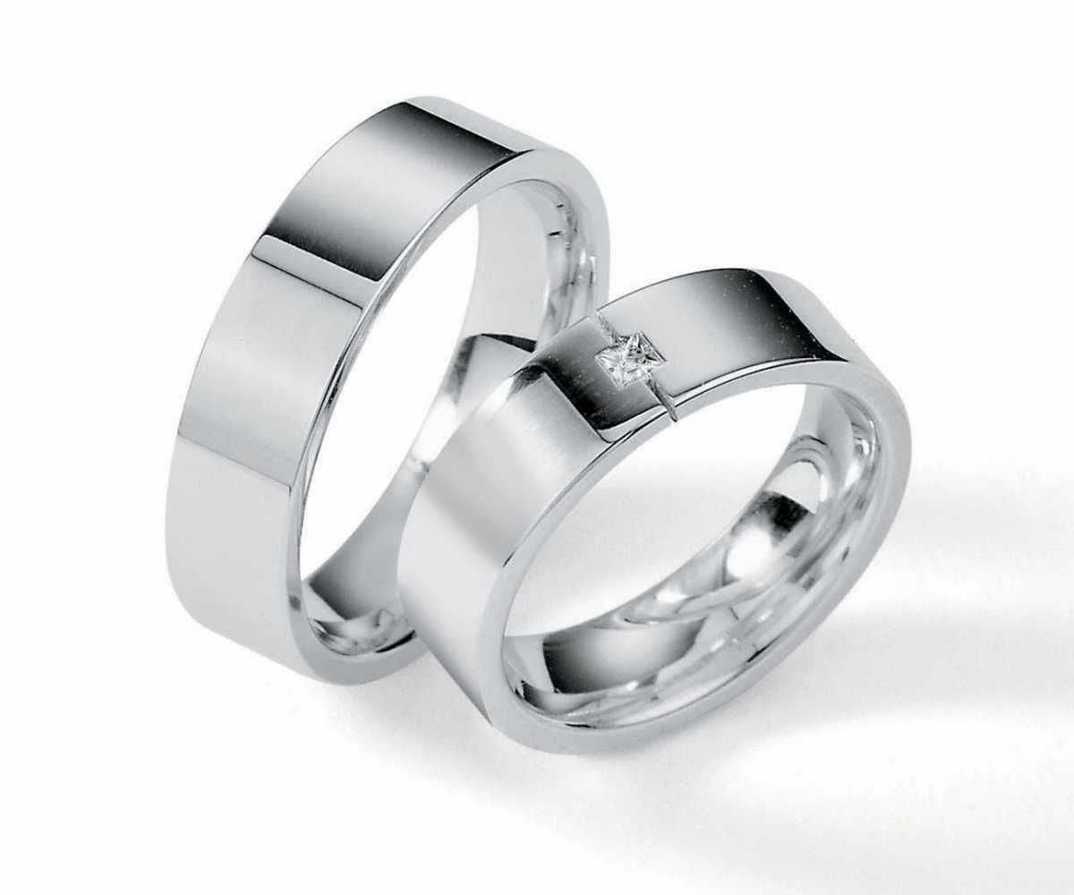 Обручальные парные кольца Дамиани из белого золота