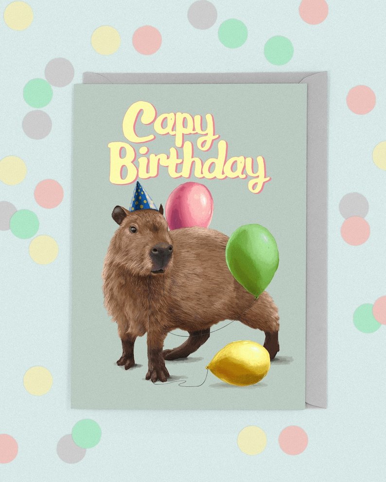 Капибара в шапке Деда Мороза